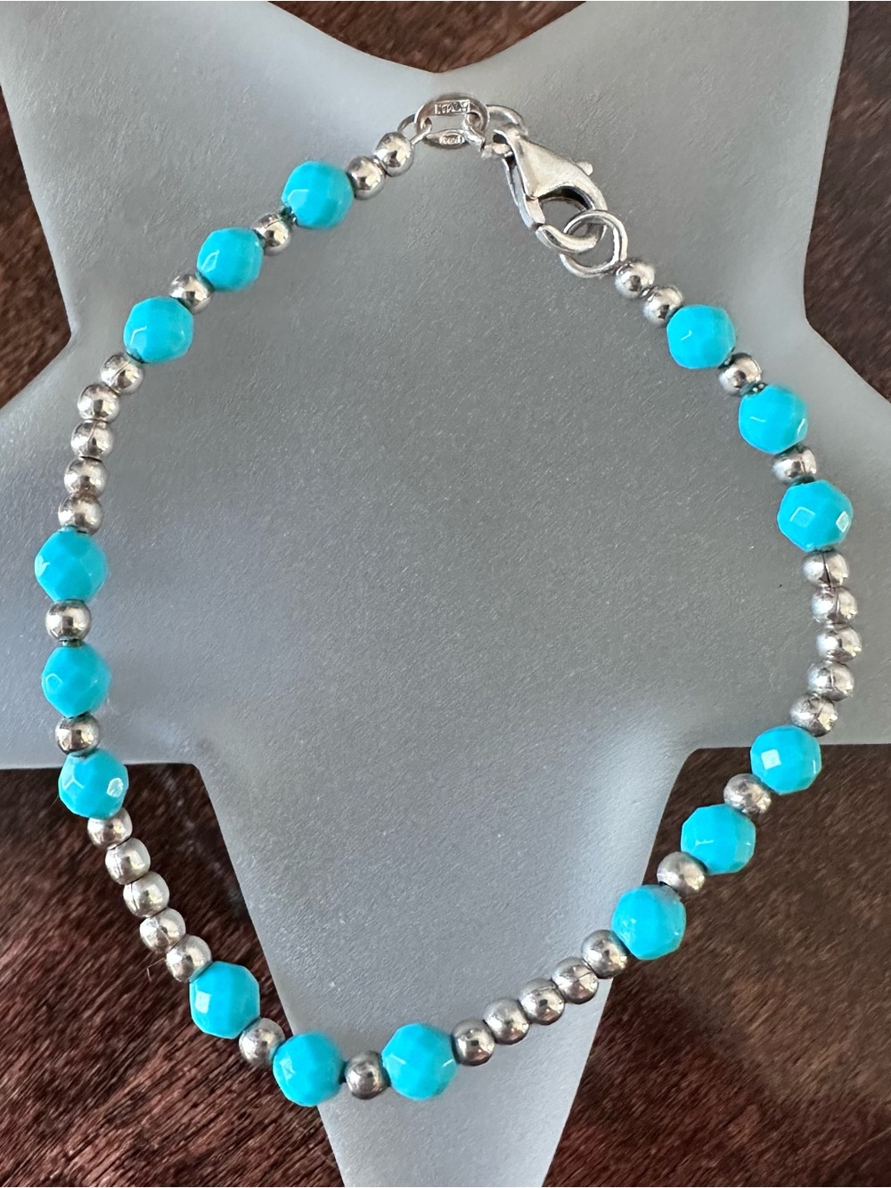 Sterling silver beaded bracelet with turquoise colored accent beads